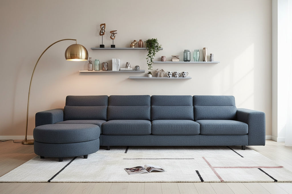 Blue sectional sofa in a living room with shelves and decor.