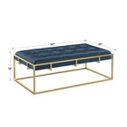 Pouf rettangolare trapuntato in velluto con finitura oro