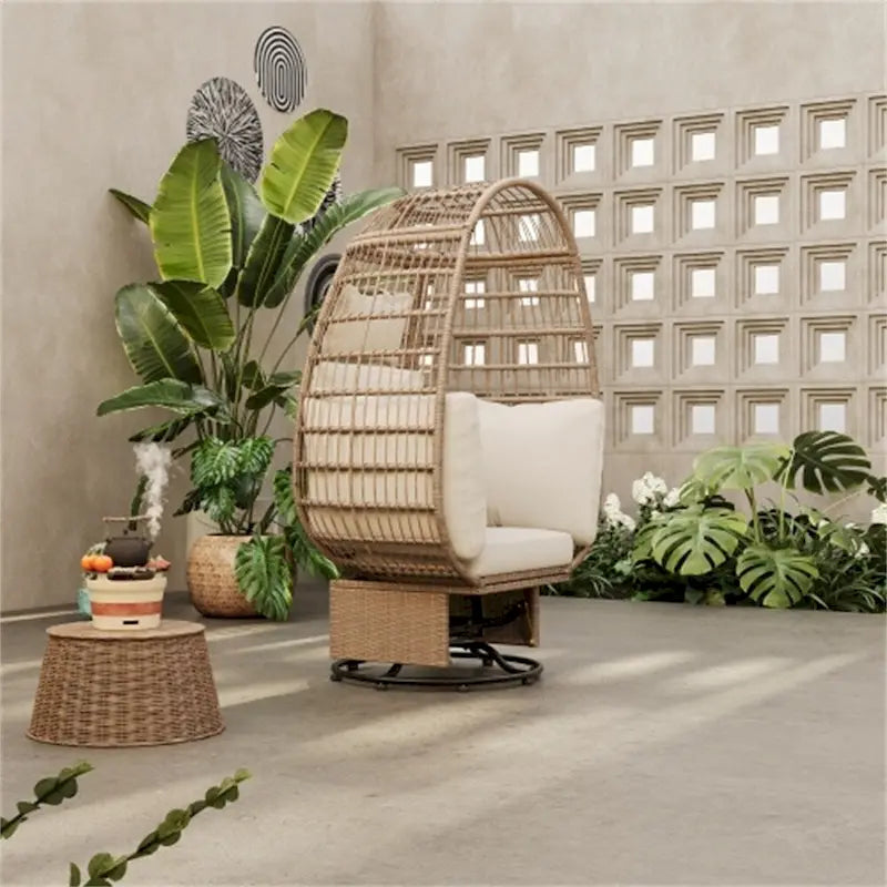 Poltrona a dondolo girevole da patio in rattan a forma di uovo con cuscini